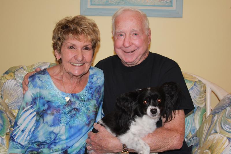 Newlyweds Joan and Bob Rice relax in their Lewes home with their dog, Chrissy. MELISSA STEELE PHOTO
